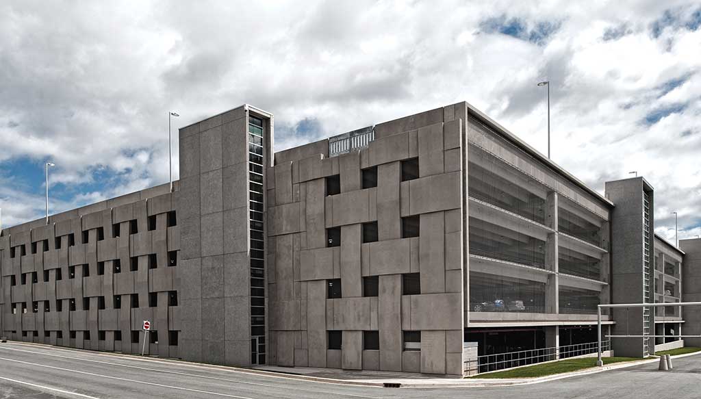 Parking Garage at the Halifax International Airport - The basket weave effect on the load bearing precast wall and the use of long span double tees permitted more natural light, which reduced the energy requirements during the day.